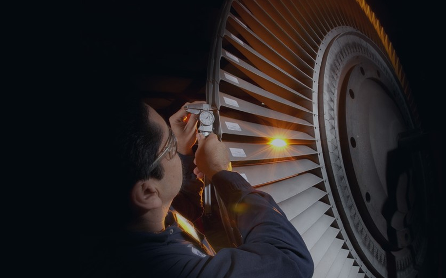 Industrial turbine wheel inspection by technician